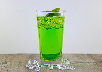 A glass of nutritious estragon drink to maintain a healthy lifestyle. Were added to the drink ice.