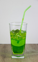A glass of nutritious estragon drink to maintain a healthy lifestyle. Were added to the drink ice.