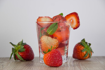 Jelly from strawberry juice with the addition of fresh berries. Were added to the drink ice.