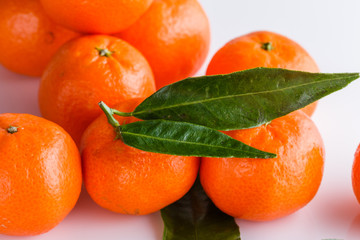 juicy mandarin on a white acrylic background