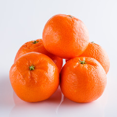 juicy mandarin on a white acrylic background