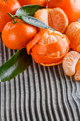 juicy mandarin on a gray wooden rustic background