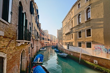 Fototapeta na wymiar Venice, Italy - December 29, 2018: Typical view in the old town with water channels and bridges