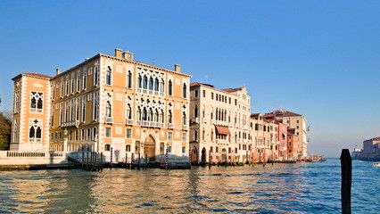 Typical view of the old city of Venice, Italy, with canals, bridges, ancient buildings immersed in water, boats and gondolas