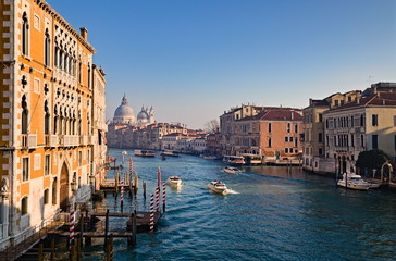 Fototapeta premium View of the Grand Canal in Venice, Italy, from the Ponte dell'Accademia, with a ferry crossing the canal