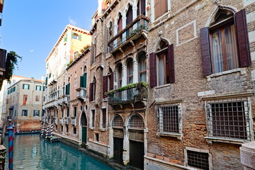 Fototapeta na wymiar Venice, Italy - December 29, 2018: Typical view in the old town with water channels and bridges