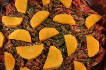 Minced meat, carrots and Provencal herbs in a pan