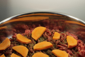 Minced meat, carrots and Provencal herbs in a pan