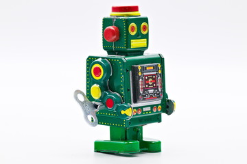 Naklejka premium Green vintage old wind up toy robot isolated on white limbo background