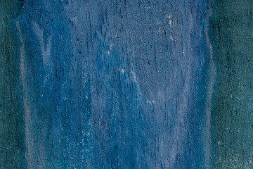 cracked old turquoise paint on wooden background