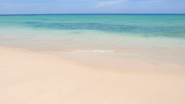Perfect sandy beach scene, warm water with calm waves and white sand