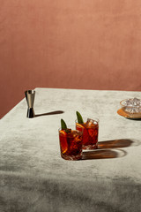 Negroni, an Iba cocktail, with 1/3 gin, 1/3 bitter, 1/3 vermut, in luxury pop style, rich and...