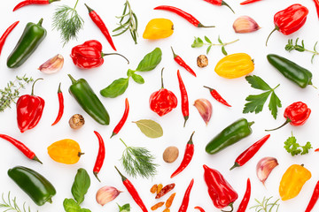 Spice herbal leaves and chili pepper on white background. Vegetables pattern. Floral and vegetables on white background. Top view, flat lay.