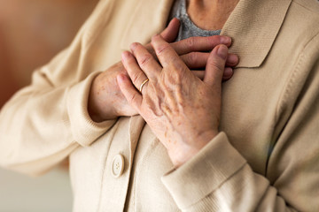 Senior Woman Suffering From Chest Pain