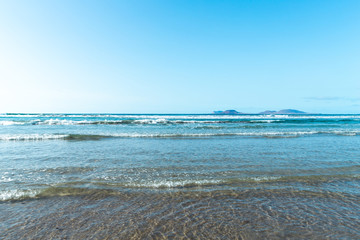Fototapeta na wymiar Beach view at Caleta de Famara, Lanzarote.