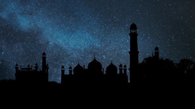 Badshahi Mosque in Silhouette by Night with Stars and Milky Way in Background, one of the largest Mosques in the World, Lahore, Pakistan