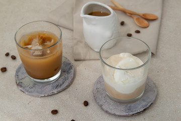  Iced coffee with ice cream and ice in glasses on the table.