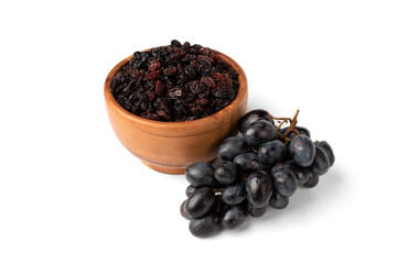 Raisin and grapes isolated on white background.