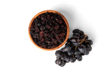 Raisin and grapes isolated on white background.