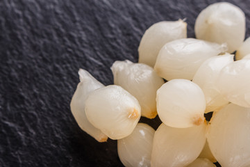 pickled vegetables on a dark stone background