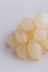 pickled vegetables on a white acrylic background