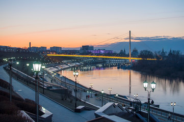 Tyumen, Russia, on April 19, 2019: A spring high water on the embankment in Tyumen in the evening.