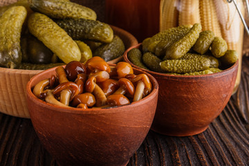 pickled vegetables on a wooden rustic background