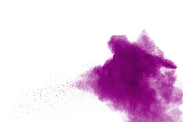 Fototapeta premium Purple color powder explosion cloud on white background.Closeup of purple dust particles splash on background.