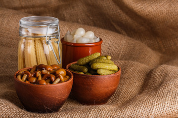 pickled vegetables on a wooden rustic background