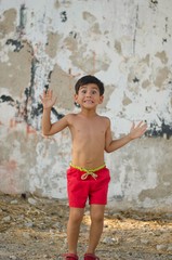 Little boy happily salutes us