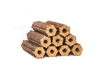 Fuel briquettes folded in rows on a white background. Wooden  briquettes are an environmentally...