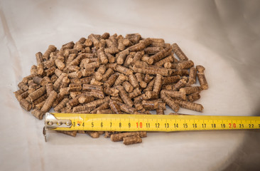 Fuel briquettes folded in rows on a white background. Wooden  briquettes are an environmentally...