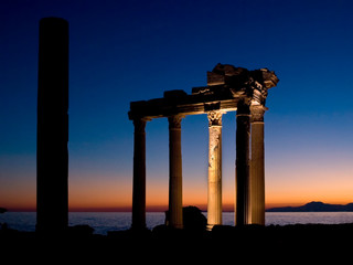 Naklejka premium The remains of the temple of Apollo at Side on the southern coast of Turkey. Showing the remains as the sun is setting over the Mediterranean. 