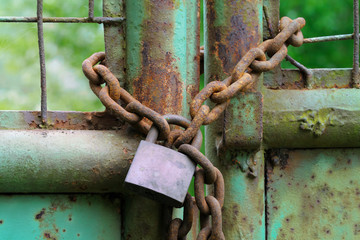 Rusty chain on yard gate, Germany