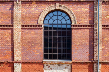 Walls and windows. Old brick wall with one big window.