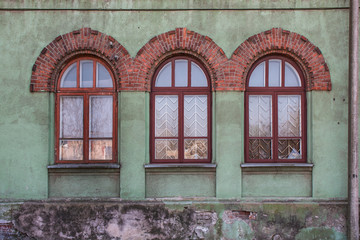Walls and windows.Old facade , wall with three windows. 