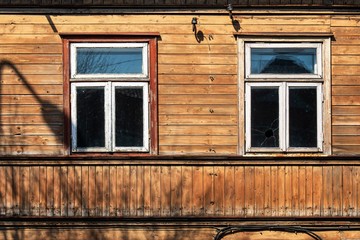 Walls and windows.Wooden wall with two window.