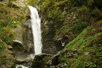 Fototapeta na wymiar Tourist on the trekking to the Gurgeniani waterfall in Lagodekhi Nature Reserve in Georgia, Kakheti region