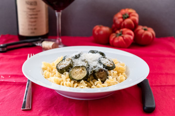 Italian food: pasta with zucchini and parmesan