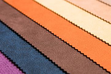 Close-up diagonal lines of textile upholstery in samples to select the color and fabric of the furniture. Abstract multicolored background