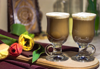 coffee latte and fresh flowers for two