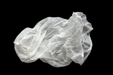 Fototapeta premium Plastic bag on a black background, isolate. Used plastic bag for recycling. Recycling of plastic waste into pellets as a business.