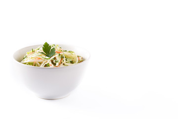 Coleslaw salad in white bowl isolated on white background. Copyspace