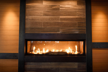 Modern gas fireplace in wall of Brewhouse restaurant Toronto