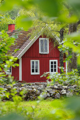 Fototapeta na wymiar Red wooden house in sweden, Scandinavia, Europe