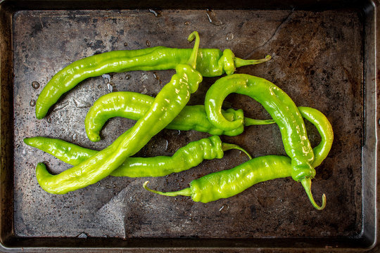 Whole Green Banana Pepper Group With Stems On Metal Tray Flat Lay