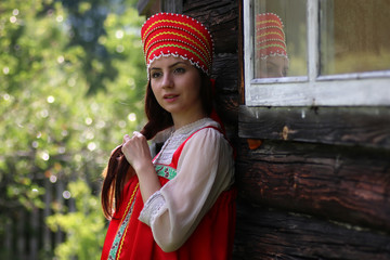 Slav woman in traditional dress wooden wall