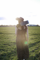 girl outdoor field sunset texas hat