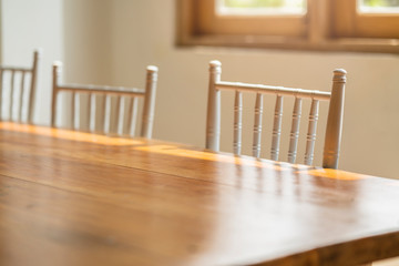 dining table set in country style with light from wooden window