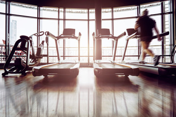 healthy ideas concept treadmill in gym with big window light background